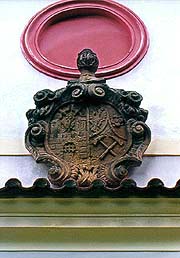 Chapel on Křížová hora (Cross Hill) in Český Krumlov, coat-of-arms of town and miners above the portal 